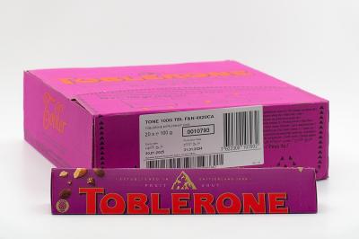 Шоколад швейцарский Toblerone молочный с медово-миндальной нугой с изюмом и орехом 100 гр